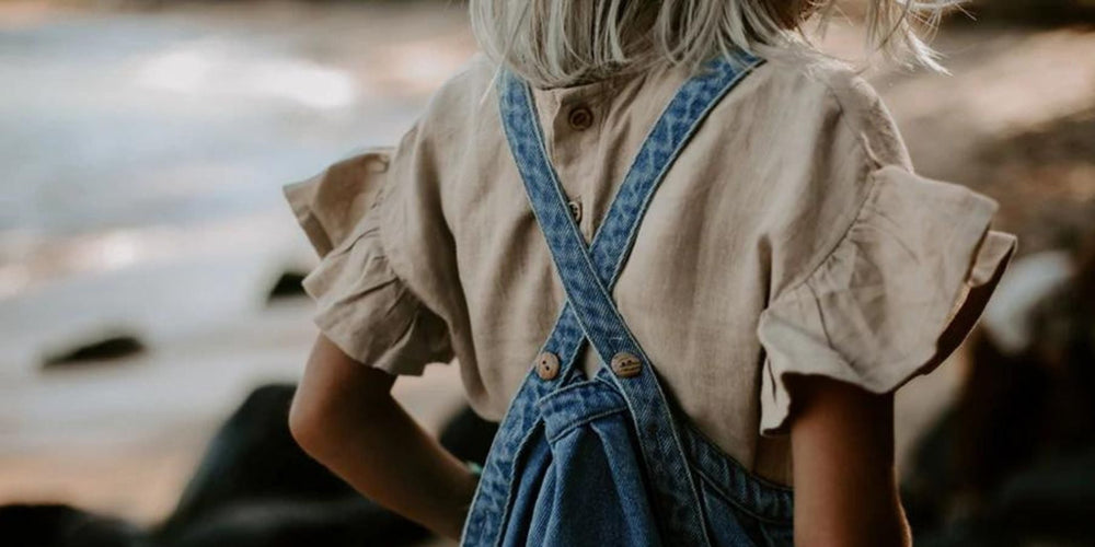 The Simple Folk Collection: Adorable child's outfit featuring a stylish denim romper, perfect gift for little adventurers.