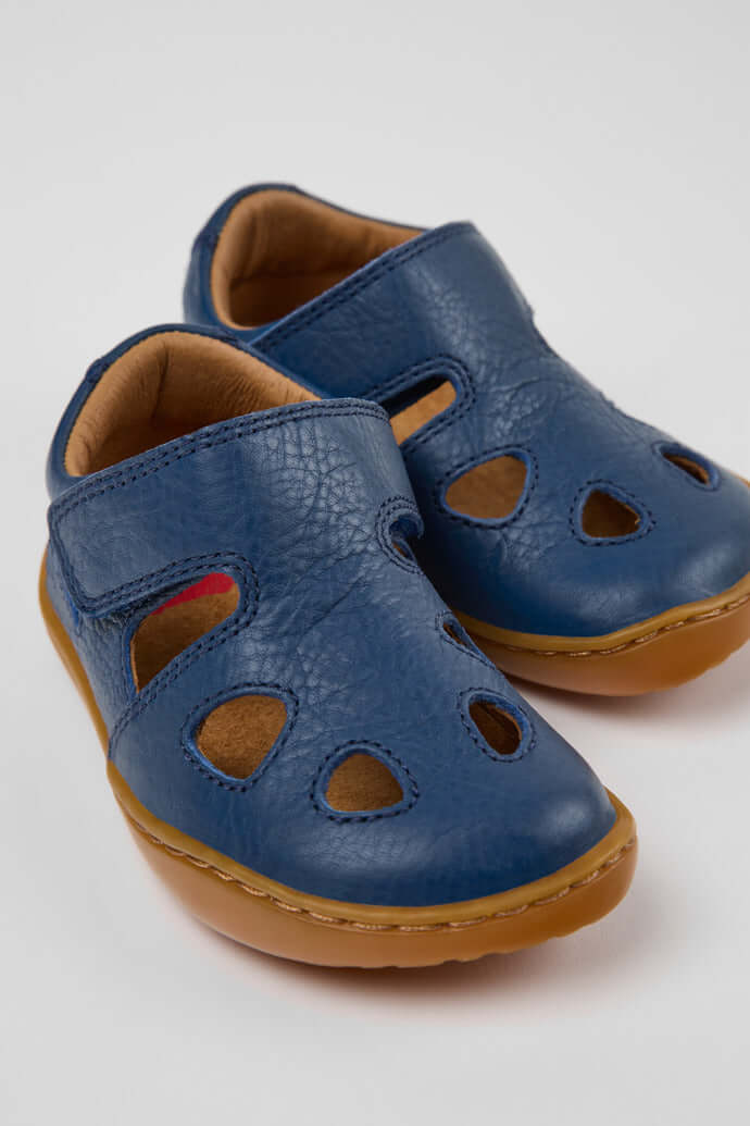 Blue leather closed sandals for kids featuring a hook-and-loop design and flexible soles from Acorn & Pip.