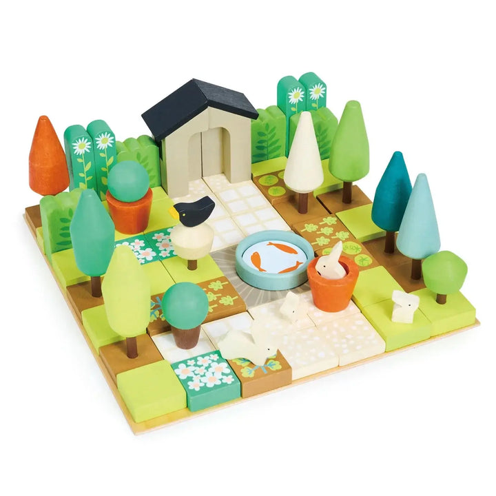 Colorful wooden garden design toy for kids featuring trees, plants, and a pond, perfect for creative play.