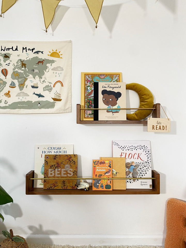 Autumn's Corner A.C Editions solid oak wall shelf displaying children's books in a nursery